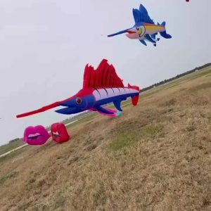 A sailfish-shaped inflatable kite with a long pointed bill and a tall dorsal fin.