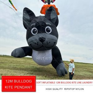 A black inflatable dog kite with pointed ears, large eyes and a gray muzzle.